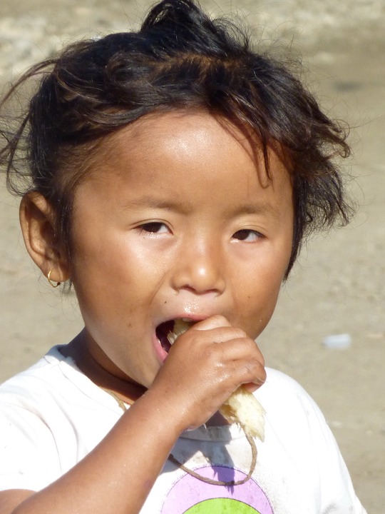 Eating a piece of sugar cane