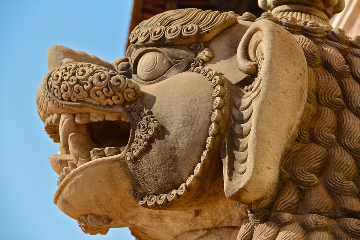 Stone lion guarding a shrine