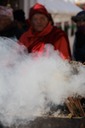Burning incense surrounds the stupa